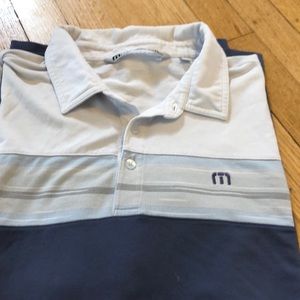 Travis Mathew golf shirt.